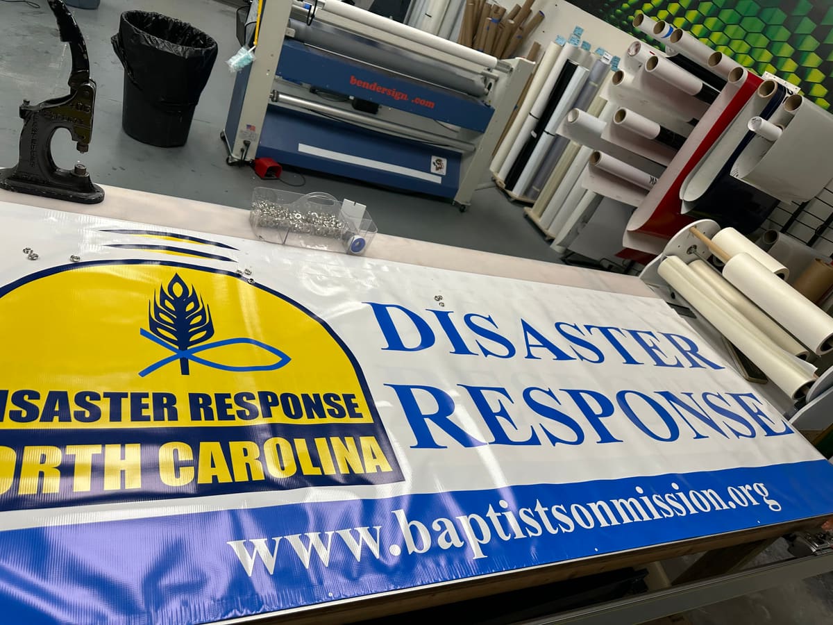 NC Baptists on Mission Disaster Response banner on the print-shop finishing table