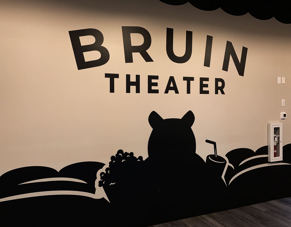 Bruin Theater wall vinyl mural of a bear silhouette across theater seating