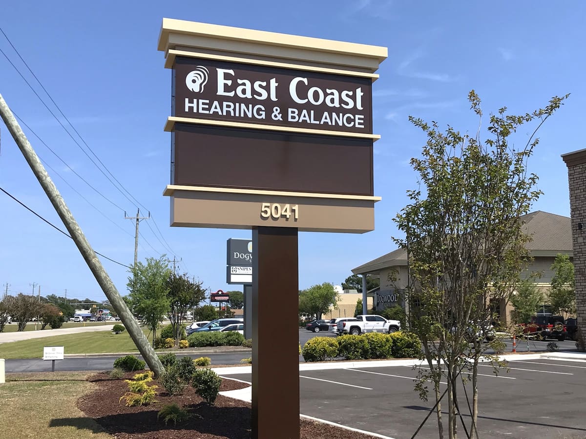 East Coast Hearing & Balance pylon sign with reader board on a sunny day