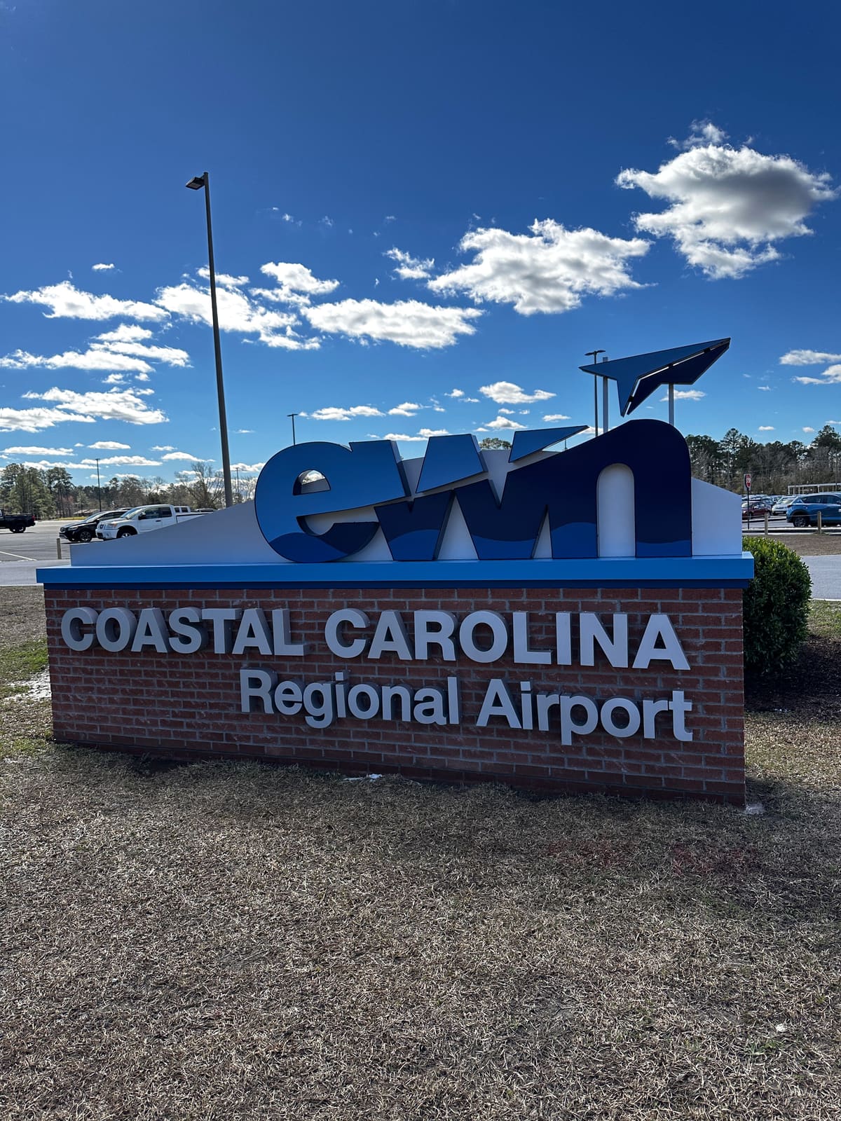Coastal Carolina Regional Airport ewn monument sign, portrait crop against deep blue sky