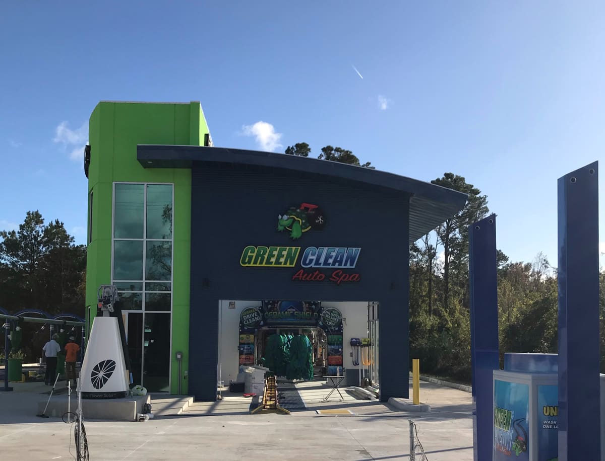 Green Clean Auto Spa channel letters on a lime-green car wash building