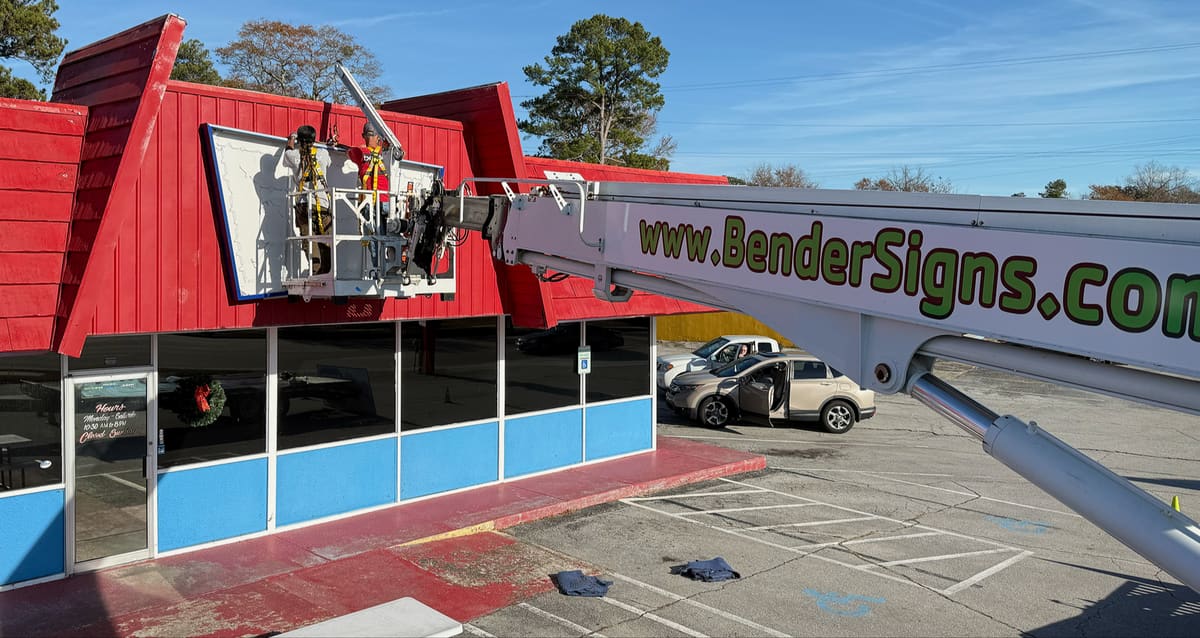 Crew and BenderSigns.com boom installing the Jeff’s Burgers building sign