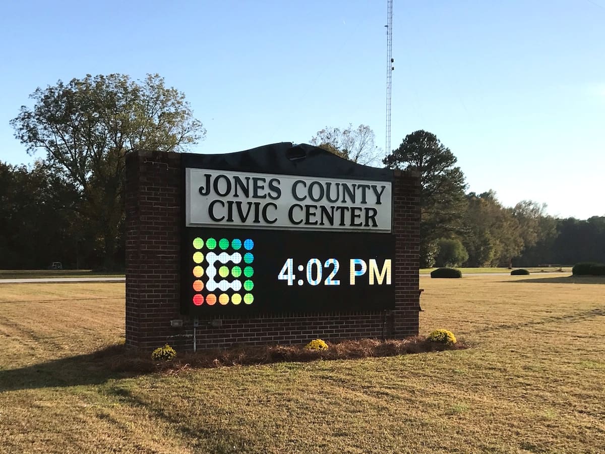 Jones County Civic Center brick monument sign with full-color LED board in golden light