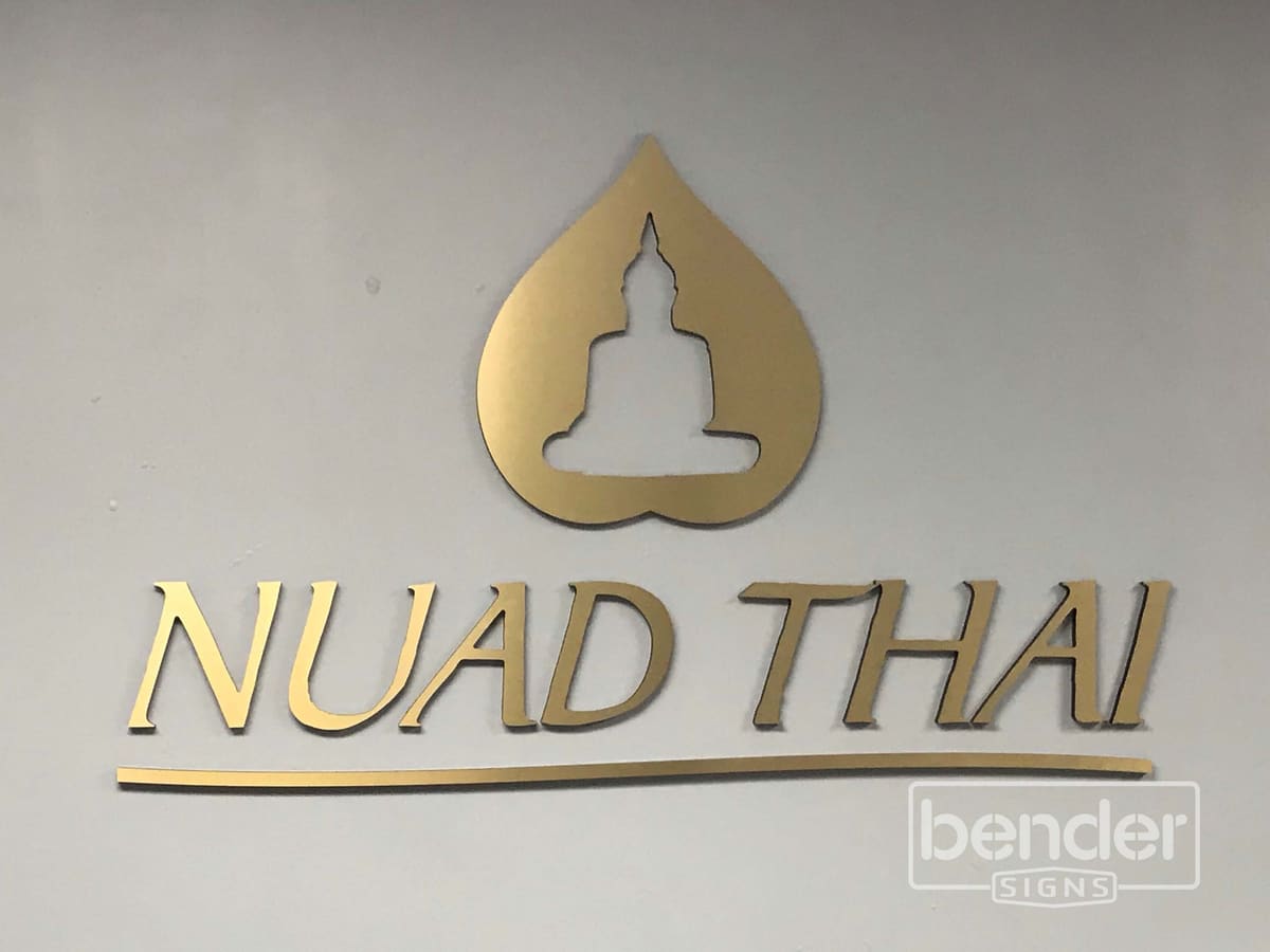 Nuad Thai brushed-gold dimensional interior sign with Buddha emblem