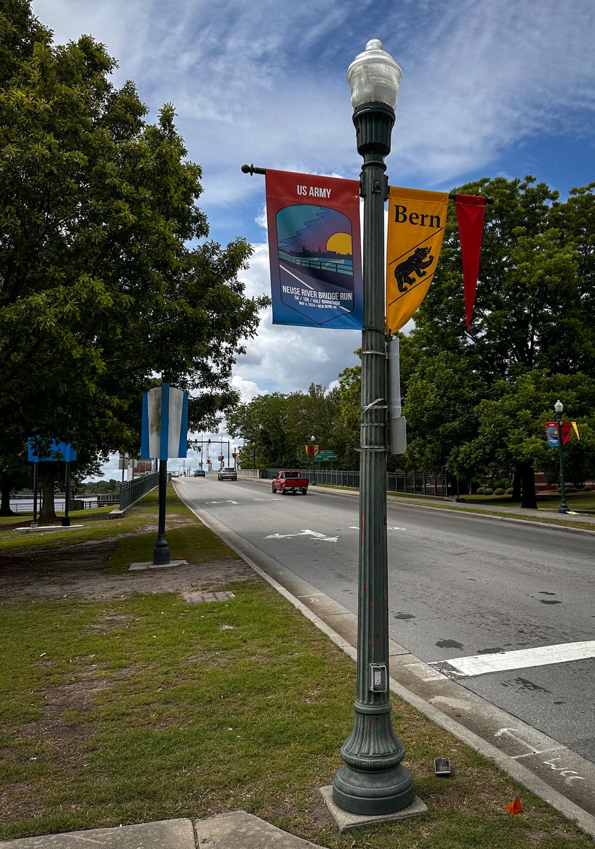 Printed pole banners for the Neuse River Bridge Run and the Bern bear on downtown New Bern lamp posts
