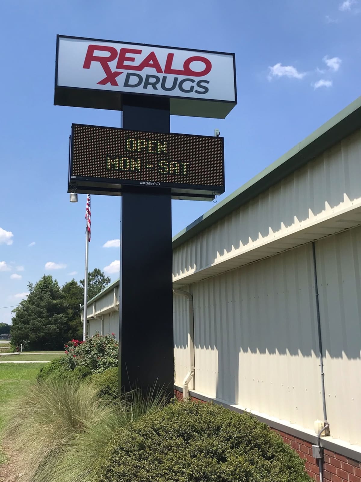 Realo Drugs pylon sign with LED readerboard